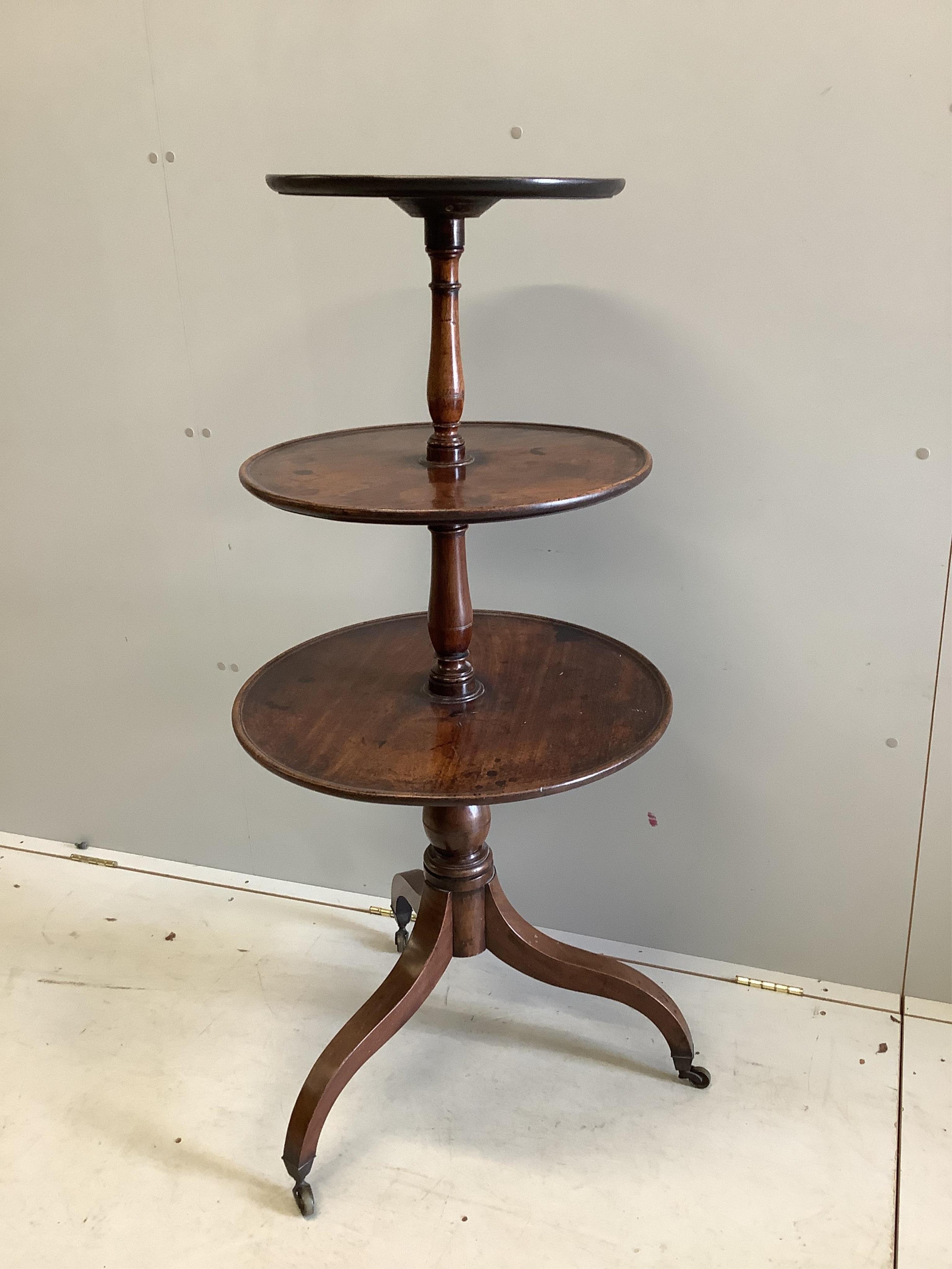 A George III mahogany dumb waiter, height 126cm. Condition - fair to good